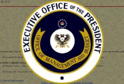 The Seal of the Office of Management and Budget (OMB) imposed over a document.