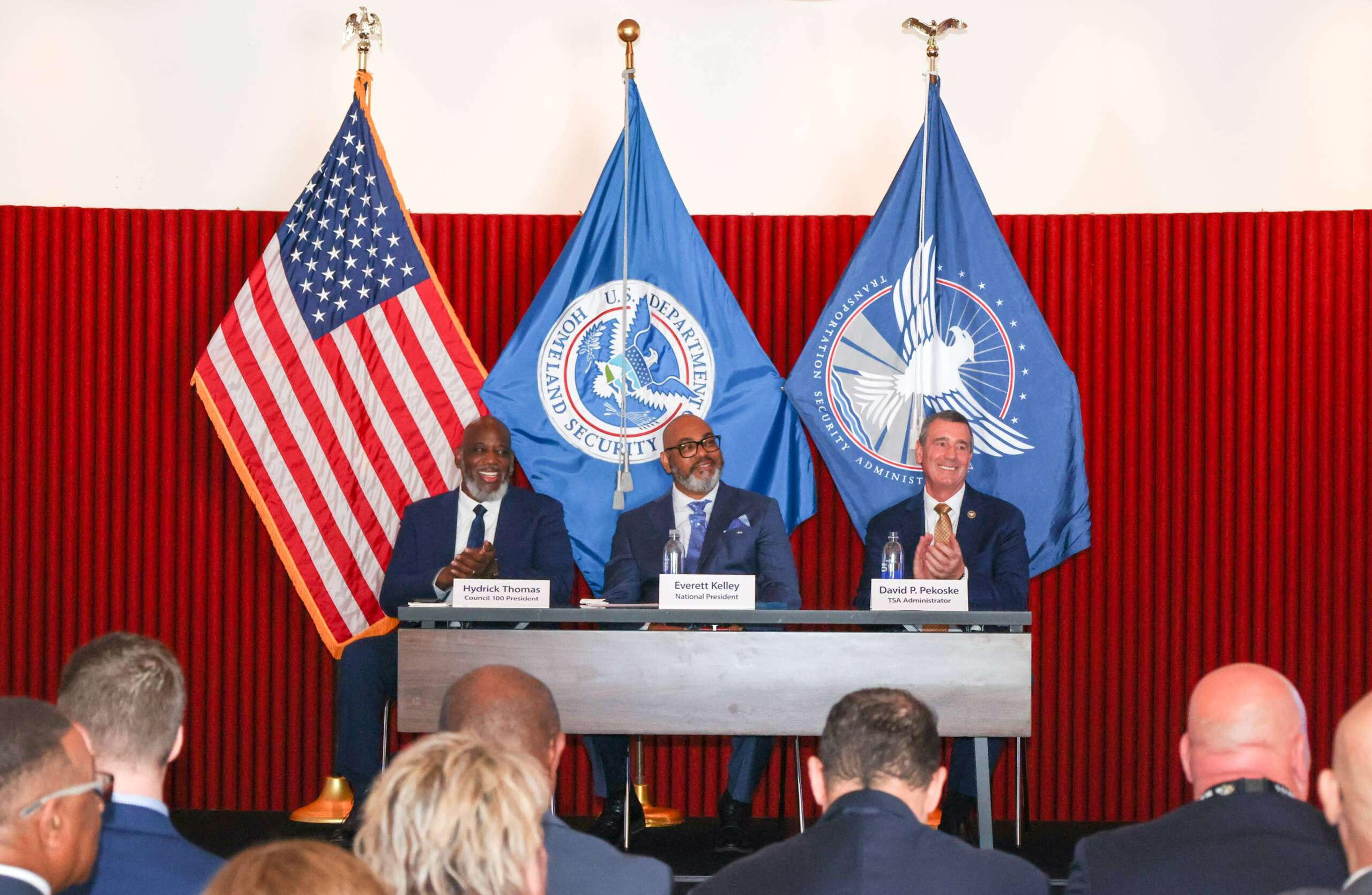 Image of AFGE and TSA leaders at CBA signing ceremony.